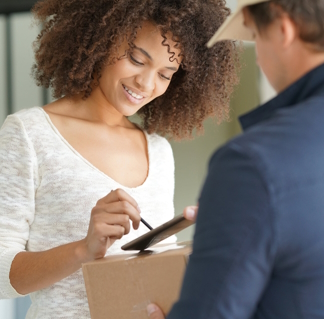 Woman giving an e-signature upon delivery using the delivery driver app