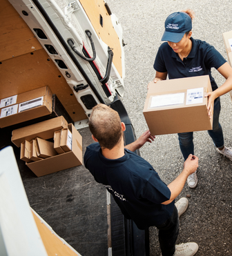 Delivery drivers packing van in the correct order given by SmartRoutes to fill the vehicle to full capacity